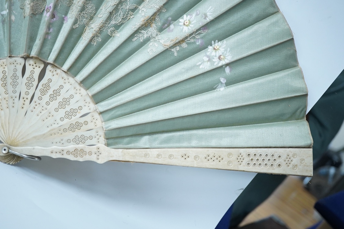 A collection of 19th century and later fans to include a black lacquered and lace example and a hand painted floral example